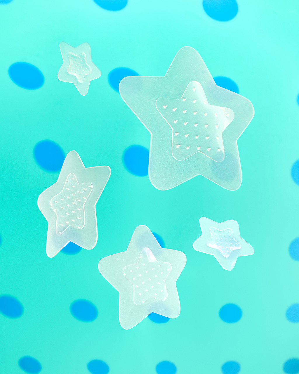 Closeup of a Starface Hydro-Star® Microdarts + Salicylic Acid patch on a spot. Microdarts target early-stage pimples.