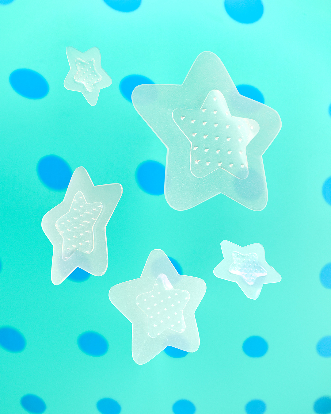 Closeup of a Starface Hydro-Star® Microdarts + Salicylic Acid patch on a spot. Microdarts target early-stage pimples.
