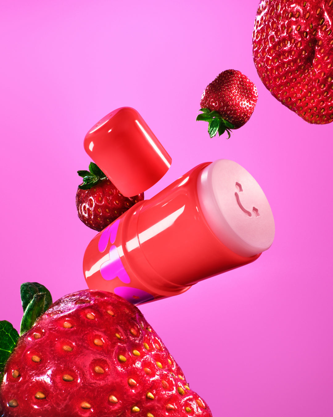 Starface Star Balm® So Strawberry lip balm uncapped. Shea butter, cocoa butter and coconut oil hydrate lips.
