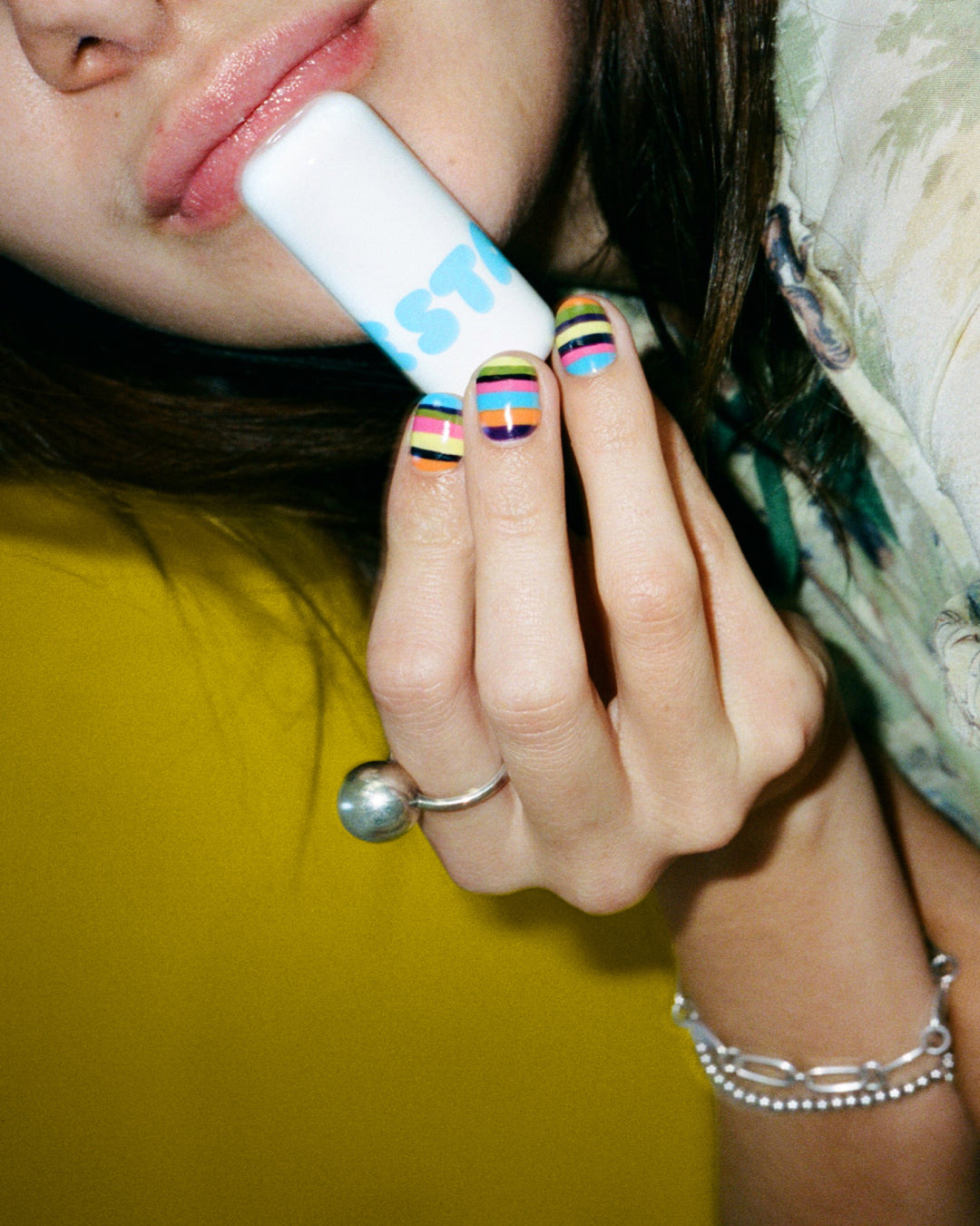 Closeup of a person applying Starface Star Balm® Very Vanilla. The creamy vanilla lip balm glides on smoothly.