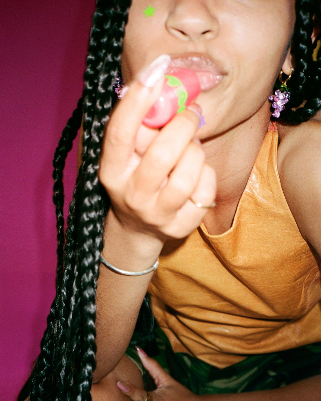 Closeup applying Starface Star Balm® Watermelon Squeeze. The fresh watermelon lip balm glides on smoothly.