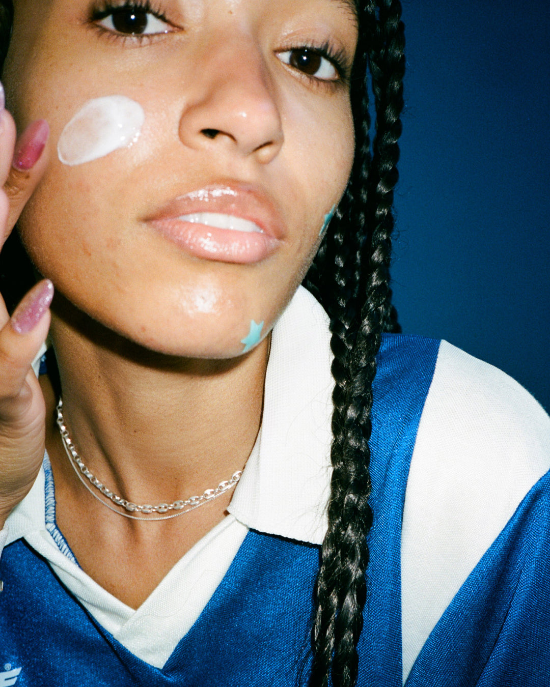 A person applying Starface Star Cream® + Salicylic Acid moisturizer. Lightweight, oil-free cream for a dewy finish.
