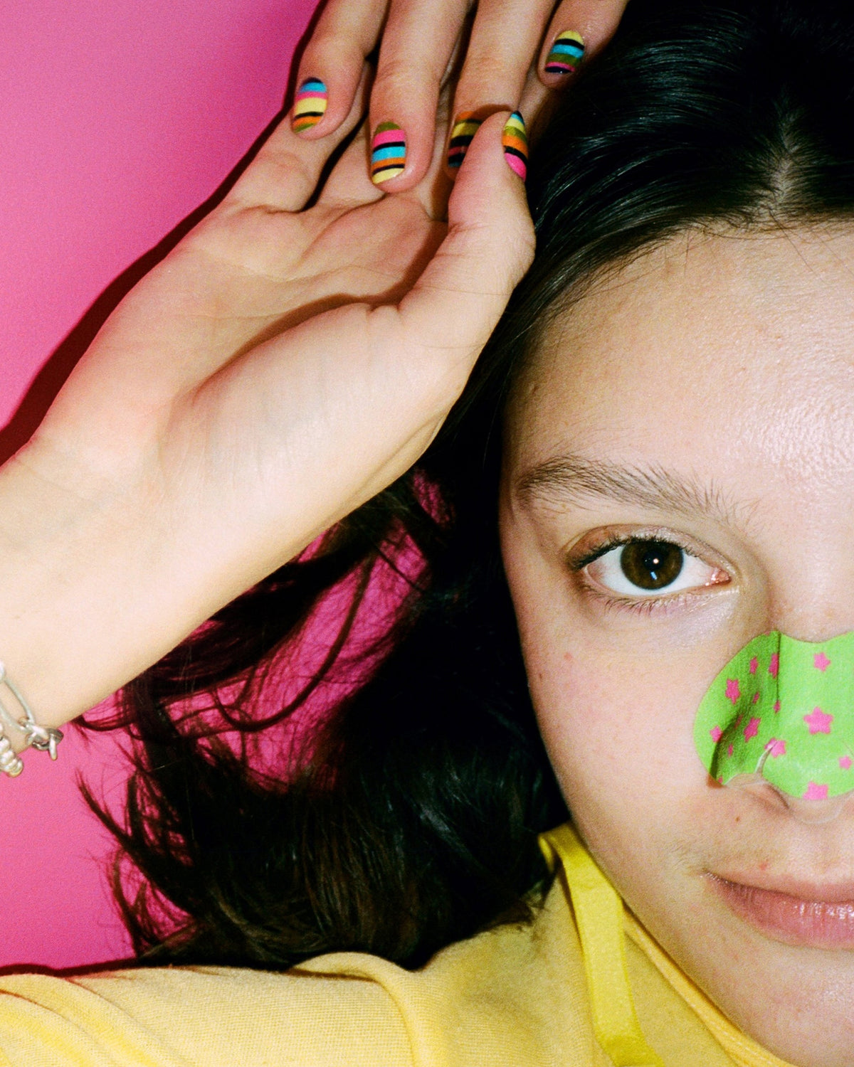 A colorful Starface pore strip shaped for the nose. Star Strips™ lift away oil, dirt and blackheads.